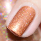 Amber vegan quick-dry nail polish in warm golden-orange with a high-shine finish, 10-free and cruelty-free.