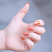 He Loves Me, He Loves Me Not – Vegan 10-free multichromatic nail polish shifting from gold to bronze to red, plant-based, and cruelty-free.