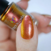 He Loves Me, He Loves Me Not – Vegan 10-free multichromatic nail polish shifting from gold to bronze to red, plant-based, and cruelty-free.