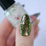Under the Freezing Spell – Vegan 10-free multichrome nail polish shifting green to gold to pink with a shimmer finish, plant-based and cruelty-free