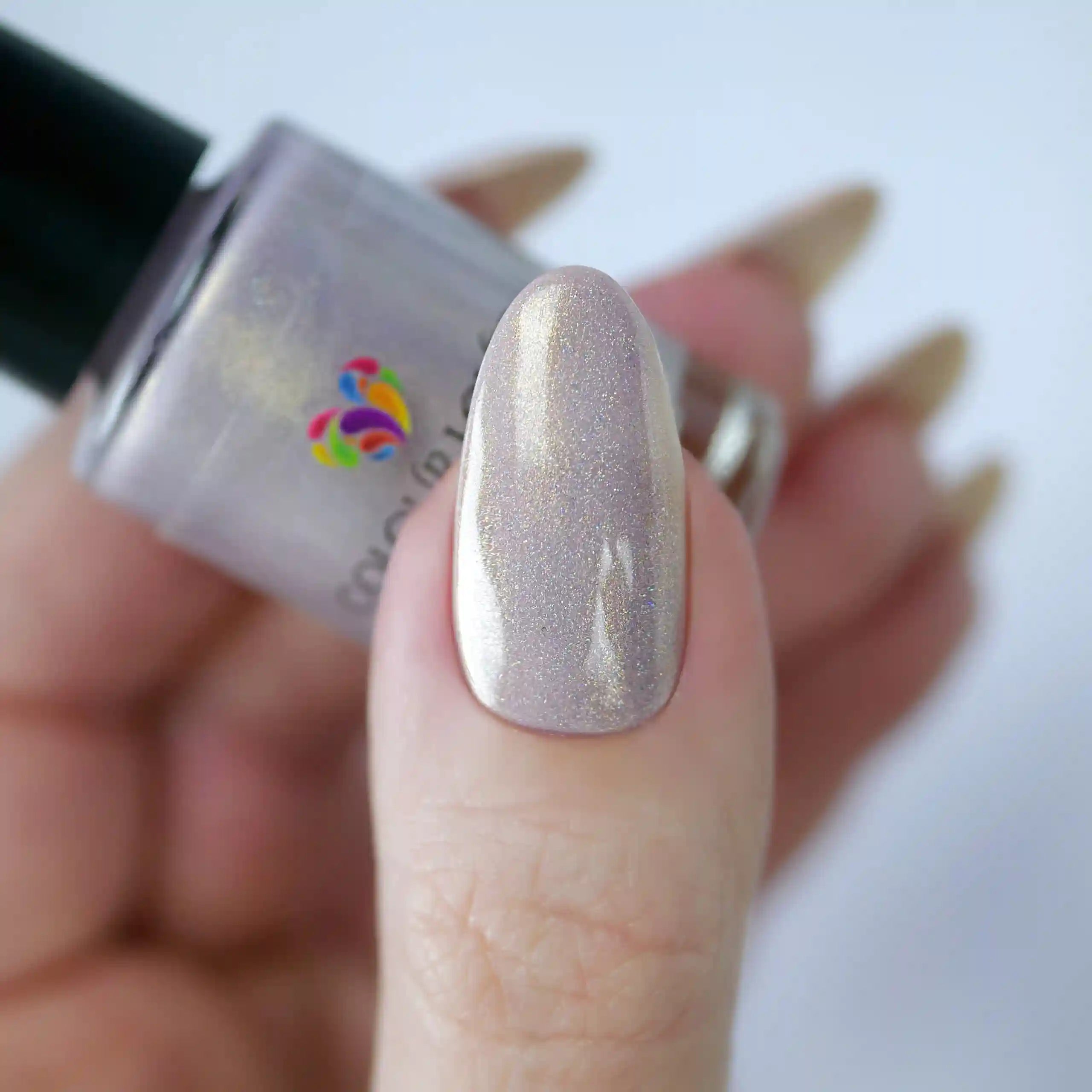 Afternoon Tea vegan quick-dry nail polish in soft pink with holographic gold shimmer, plant-based and long-lasting.