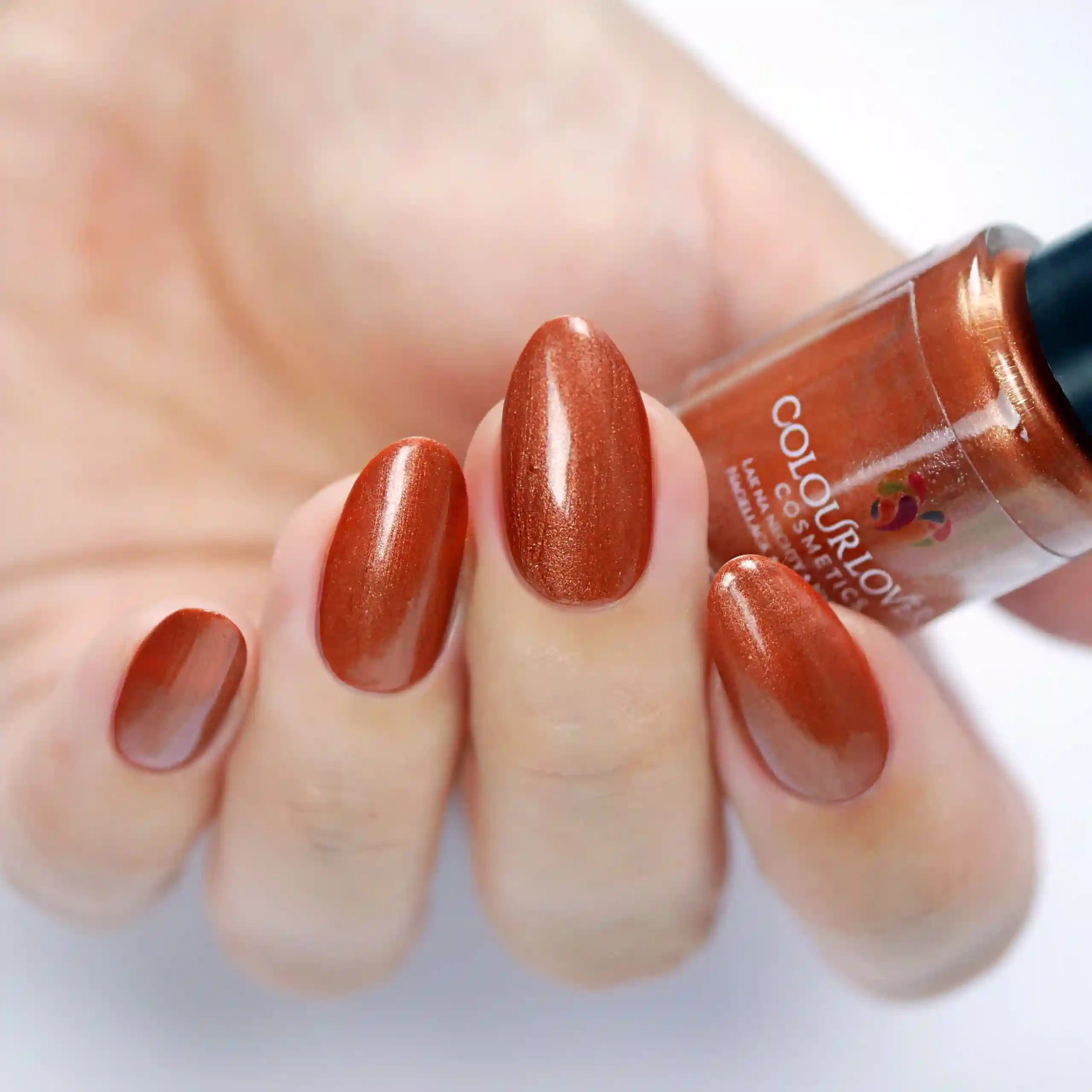 Soft nude and bronze shades with a holographic and metallic finish, perfect for summer manicures.