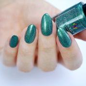 dark green nail polish with holographic pigment with plant based, 10-free, vegan, cruelty free, sustainable, safe and healthy formula handmade in Slovakia