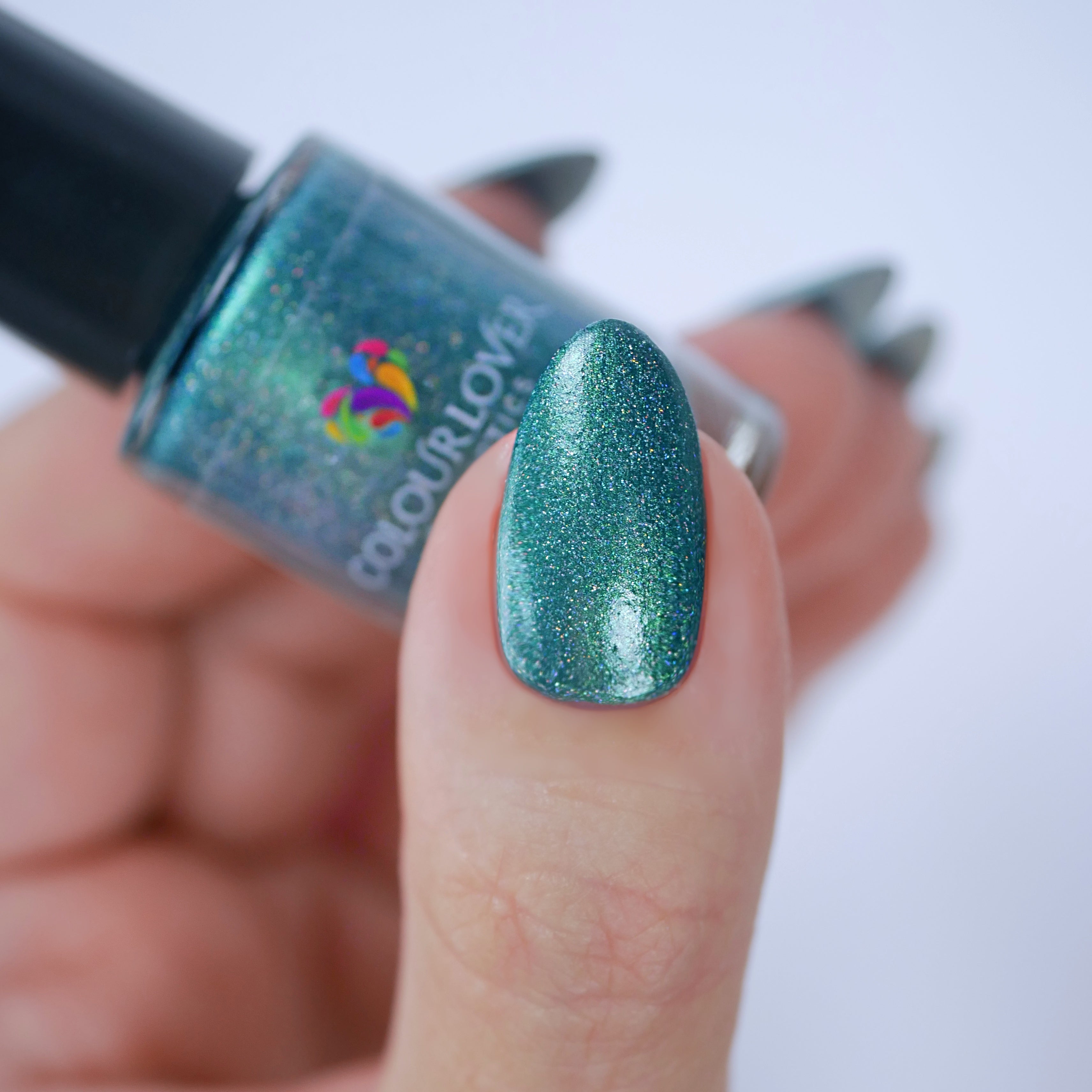 dark green nail polish with holographic pigment with plant based, 10-free, vegan, cruelty free, sustainable, safe and healthy formula handmade in Slovakia