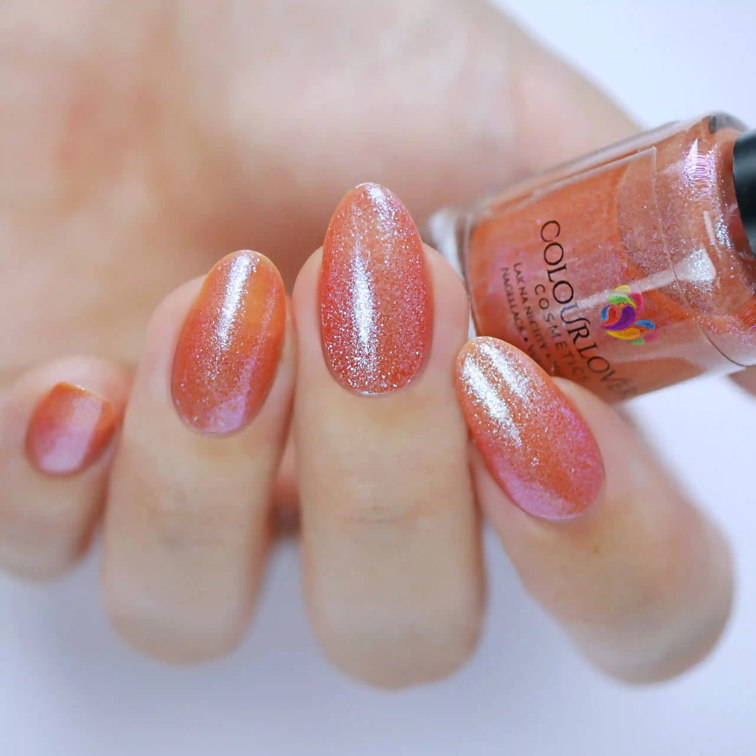 Soft nude and bronze shades with a holographic and metallic finish, perfect for summer manicures.