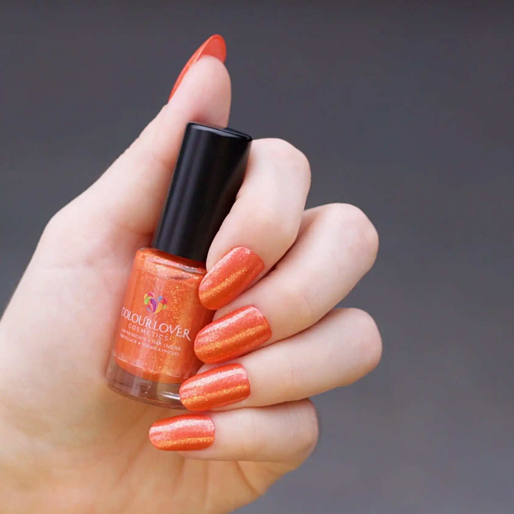 Marigold – Vegan 10-free orange shimmer nail polish with a shimmer finish, plant-based, and cruelty-free.