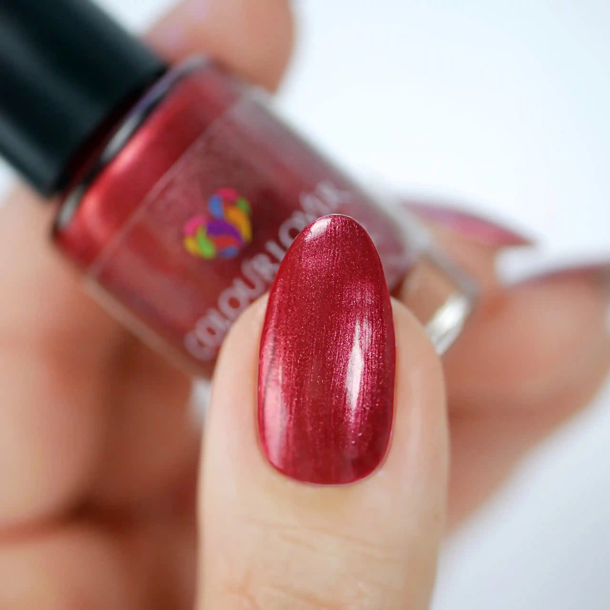 Passionate – Vegan 10-free cranberry red nail polish with a glossy finish, plant-based, and cruelty-free