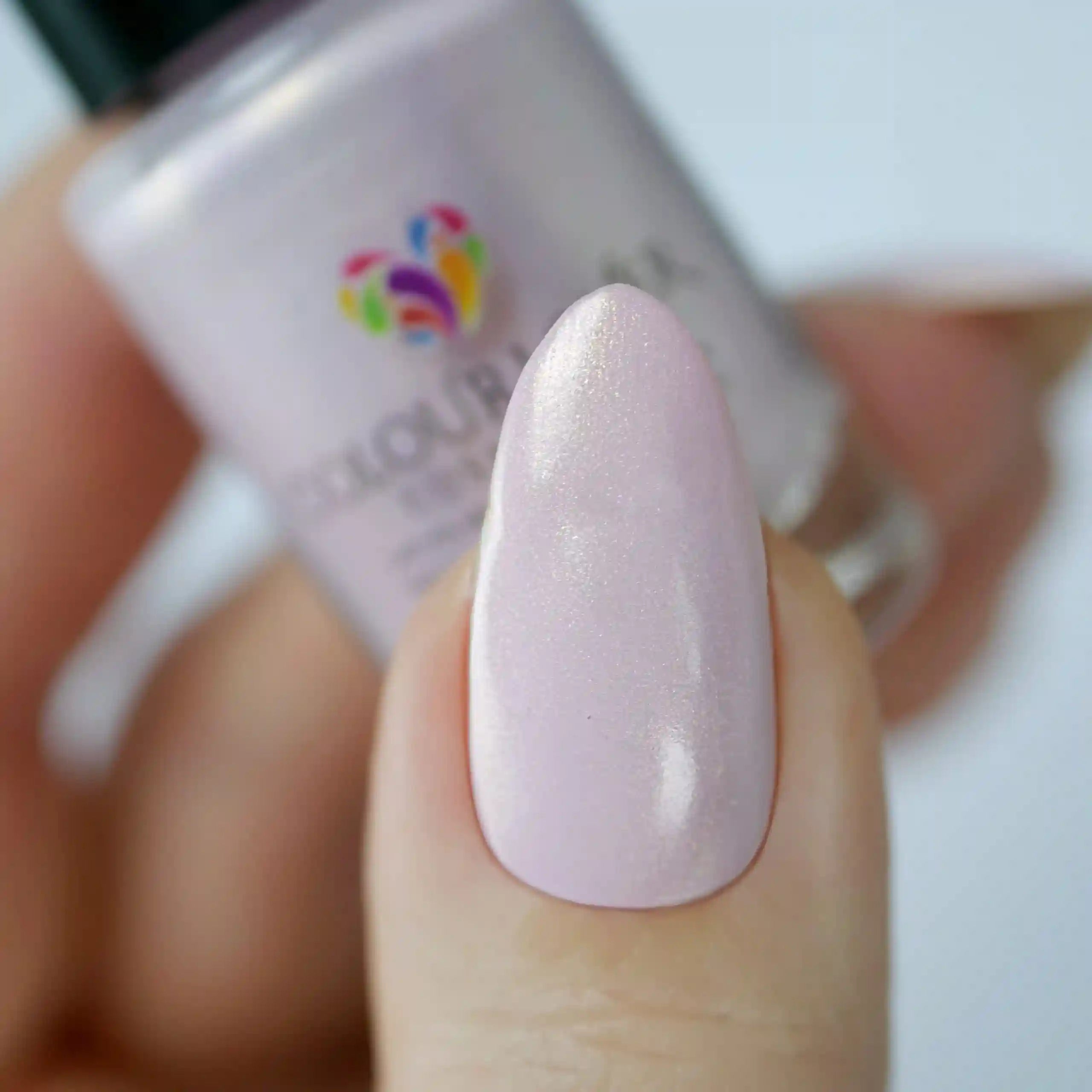 Radiant – Vegan 10-free light pink nail polish with a gold shimmer finish, plant-based, and cruelty-free
