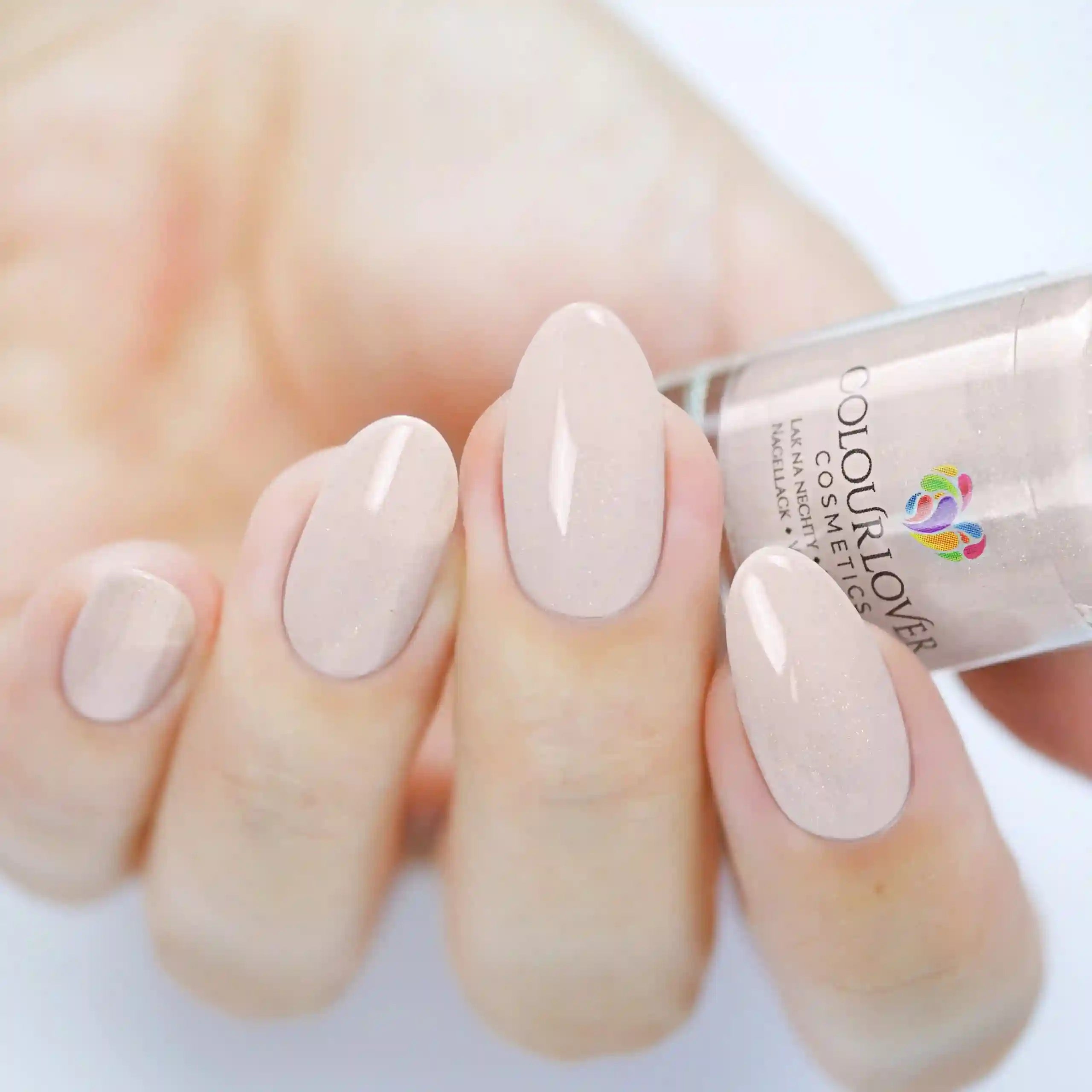 Soft nude and bronze shades with a holographic and metallic finish, perfect for summer manicures.