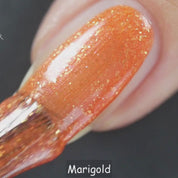 Marigold – Vegan 10-free orange shimmer nail polish with a shimmer finish, plant-based, and cruelty-free.